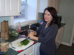 Sam chops unidentified green veggies