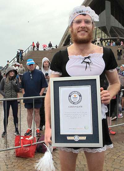 Dominic Sweeney Nash now owns the Guinness World Record for fastest marathon dressed as a French maid (male), running a 3:37:25 at the Blackmores Sydney Marathon. Image via Guinness World Records.